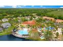 Aerial view of community amenities including a pool, clubhouse, and recreation area at 141 Pompano Beach Dr, Kissimmee, FL 34746