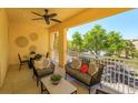 Relaxing outdoor balcony with comfortable seating, perfect for enjoying the community view and fresh air at 1447 Lake George Dr, Lake Mary, FL 32746