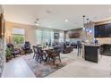 Open concept living area with a connected kitchen, dining area, and living room at 15221 Sunrise Grove Ct, Winter Garden, FL 34787