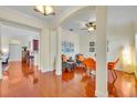 Open-concept dining area with hardwood floors and stylish furnishings at 1582 Almond Ave, Orlando, FL 32814