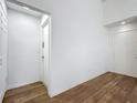 Neutral entryway with wood floors, white walls and recessed lighting at 2253 Atrium Cir, Orlando, FL 32808