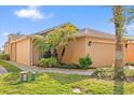 Attractive single-Gathering home features manicured landscaping, a brick walkway, and an attached two-car garage at 237 Rialto Rd, Kissimmee, FL 34759