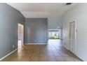 Spacious living room with tile flooring and sliding glass doors to the outside at 3143 Stonecastle Rd, Orlando, FL 32822