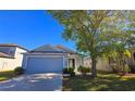 Charming single-story home with a well-manicured lawn and a two-car garage in a quiet neighborhood at 3734 Hampton Hills Dr, Lakeland, FL 33810