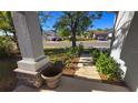 View from the porch of a suburban street with well-maintained lawns and a neatly manicured garden at 3734 Hampton Hills Dr, Lakeland, FL 33810