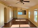 Bright, open living area with hardwood floors, arched doorways, and plenty of natural light at 3734 Hampton Hills Dr, Lakeland, FL 33810