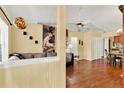 Open concept living room with wood floors and vaulted ceilings at 5429 Lake Margaret Dr # E, Orlando, FL 32812