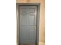 Apartment 149 has a gray door with a silver knob and peephole at 860 N Orange Ave # 149, Orlando, FL 32801