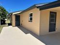 Back corner of the home with a covered patio at 124 Harrison Rd, Daytona Beach, FL 32118