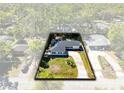 An aerial view showcases the home's landscaping and surrounding greenery at 1338 Franklin St, Altamonte Springs, FL 32701