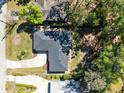 An aerial perspective of the home and roof, surrounded by trees at 1338 Franklin St, Altamonte Springs, FL 32701