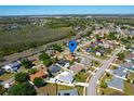 Neighborhood aerial view featuring well-maintained homes, green spaces, and convenient road access at 14901 Wild Wood Lily Ct, Orlando, FL 32824