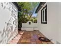 Private courtyard area featuring tiled flooring and a charming decorative water feature at 1701 Palmer Ave, Winter Park, FL 32789