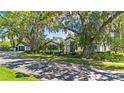 A picturesque home with lush landscaping and mature trees adding natural beauty at 1701 Palmer Ave, Winter Park, FL 32789