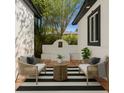 Stylish outdoor lounge space features seating and a decorative water feature, perfect for relaxation and entertaining at 1701 Palmer Ave, Winter Park, FL 32789