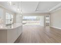 Open concept kitchen featuring stainless steel appliances and light wood flooring at 2192 Seagrass Pt # 427, Kissimmee, FL 34747