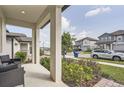 View from the front porch, showing the neighborhood street and well-kept surroundings at 2277 Crossbow St, Clermont, FL 34715