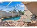 Enjoy the outdoors with a pristine backyard pool and dining area, great for relaxation at 2839 Drifting Lilly Loop, Kissimmee, FL 34747