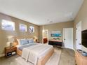 Serene bedroom featuring a comfortable bed, modern decor, and ample natural light at 30411 Gidran Ter, Mount Dora, FL 32757