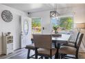 Inviting dining area with stylish table, chairs, and bright natural light coming in from the front window at 501 Catwood Dr, Ocoee, FL 34761