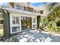 Relaxing back patio area with sliding glass doors and ample natural light at 6114 Peregrine Ave # D03, Orlando, FL 32819