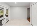 Open dining area with tile flooring, access to the porch, and an open space to the kitchen and hallway at 1811 Oakgrove Ave, Deltona, FL 32725