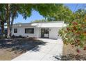 Charming single-story home featuring a well-maintained lawn and a long concrete driveway at 2429 Yale Ave, Sanford, FL 32771