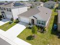 Inviting single-story home boasting a well-manicured lawn and attached two-car garage at 2569 Trinidad Rd, Haines City, FL 33844