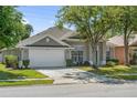 Beautiful one-story home featuring a two-car garage and classic design at 2867 Oconnell Dr, Kissimmee, FL 34741