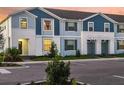 A view of the exterior of several townhomes in a landscaped setting at 4166 Lana Ave, Davenport, FL 33897