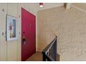 Hallway area featuring a fire extinguisher and a bright red entrance door at 429 Sheoah Blvd # 3, Winter Springs, FL 32708