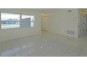 This room offers tiled floors, a large window for natural light, and ample space for entertaining guests at 7717 Boreas Dr, Orlando, FL 32822