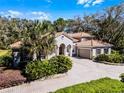 Charming two-story home with a tile roof and well-maintained landscaping in a serene setting at 8713 Shimmering Pine Pl, Sanford, FL 32771