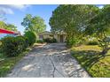 Charming single-story home featuring a spacious driveway and well-maintained front lawn at 2027 La Due Ct, Orlando, FL 32811