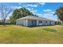 Inviting one-story home with a well-maintained lawn and colorful landscaping offering a cozy curb appeal at 284 Mississippi Woods Ln, Orlando, FL 32824