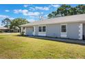 A charming house with lovely landscaping, well manicured lawn and new paint at 284 Mississippi Woods Ln, Orlando, FL 32824