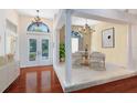 Grand foyer with soaring ceilings, elegant chandeliers, and views of the dining room at 4622 Warrington Dr, Orlando, FL 32826