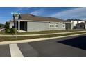 Modern home with a neutral color scheme, featuring clean lines and well-maintained landscaping at 5111 Lake Hamlin Trl, Winter Garden, FL 34787