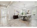 Bright dining room featuring modern decor, a stylish table, and beautiful artwork at 8433 Corkfield Ave, Orlando, FL 32832