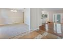 Sunlit dining room with neutral carpet and elegant chandelier at 8520 Rose Groves Rd, Orlando, FL 32818