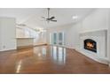 Bright living room featuring a fireplace and hardwood floors at 8520 Rose Groves Rd, Orlando, FL 32818