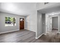 Open living room with neutral walls, modern flooring, and a view of the front yard at 912 Citrus St, Orlando, FL 32805