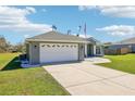 Spacious two-car garage with modern doors and clean concrete driveway at 10367 Sw 45Th Ave, Ocala, FL 34476