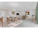 An open concept living room with a dining area, tile floor, and neutral walls at 1359 Wood Line Dr, Deland, FL 32720