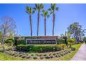 Timber Pointe community entrance sign with palm trees and lush landscaping at 16241 Old Ash Loop, Orlando, FL 32828