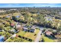 Aerial view showcases this home's proximity to a golf course, pond, and city skyline at 2259 Minnesota Ave, Winter Park, FL 32789