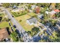 Inviting home showcasing lush front lawn, mature trees, and paved street access at 2259 Minnesota Ave, Winter Park, FL 32789