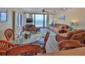 Inviting living and dining area with panoramic ocean views and comfortable seating arrangements at 2401 S Atlantic Ave # D306, New Smyrna Beach, FL 32169