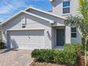 Charming home with a two car garage, paver driveway, well maintained landscaping and a covered entryway at 2861 Black Birch Dr, Ocoee, FL 34761