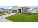 Attractive one-story home with a two-car garage and a well-maintained lawn in a residential neighborhood at 33332 Seattle Slew Dr, Sorrento, FL 32776